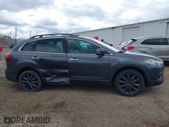 2015 Mazda CX-9 Grand Touring with VIN JM3TB3DV1F0465966, listed as a IAAI auction lot 42049749 with 74,470 mi miles and . Bid and sale history available at DreamBid. Image 13.