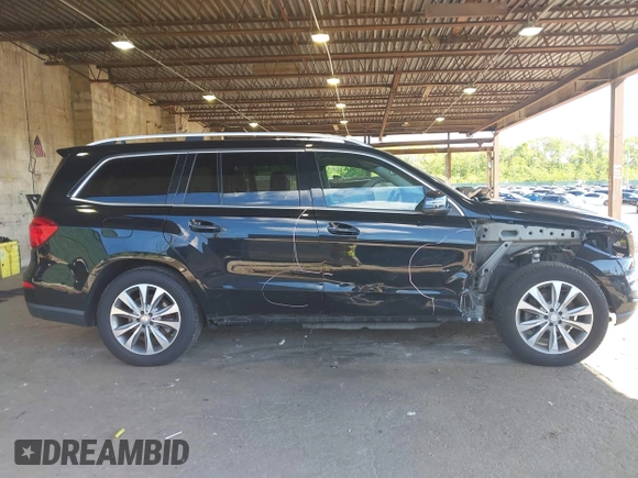 2014 Mercedes-Benz GL 450 z VIN 4JGDF7CE7EA395551, wystawiony jako IAAI lot #42247332 z przebiegiem 105 636 mil mil oraz . Historia ofert i sprzedaży dostępna na DreamBid. Obrazek 14.
