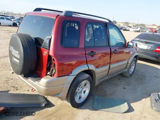 2002 Suzuki Grand Vitara JLX with VIN JS3TD62V824152943, listed as a IAAI auction lot 41668395 with 104,191 mi miles. Bid and sale history available at carsss.com. Image 4.