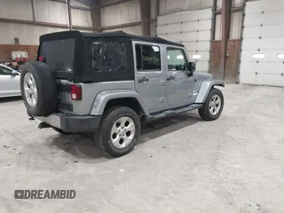 2014 Jeep Wrangler Unlimited Sahara with VIN 1C4BJWEG5EL164350, listed as a IAAI auction lot 42018586 with 113,222 mi miles. Bid and sale history available at carsss.com. Image 4.