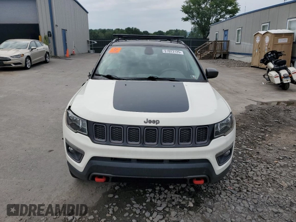 2019 Jeep Compass Trailhawk with VIN 3C4NJDDB5KT671613, listed as a Copart auction lot 61023125 with 64,793 mi miles and Salvage title. Bid and sale history available at DreamBid. Image 5.