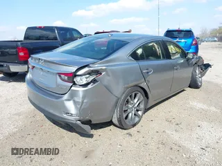 2015 Mazda 6 i Grand Touring with VIN JM1GJ1W52F1195333, listed as a IAAI auction lot 42014865 with 107,039 mi miles and . Bid and sale history available at DreamBid. Image 4.