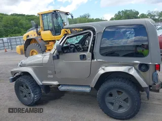 2004 Jeep Wrangler Sahara with VIN 1J4FA59S54P740417, listed as a IAAI auction lot 42382078 with 200,108 mi miles and . Bid and sale history available at DreamBid. Image 15.