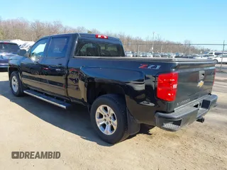 2018 Chevrolet Silverado 1500 LT with VIN 1GCUKREC3JF119906, listed as a IAAI auction lot 41765398 with 122,472 mi miles and . Bid and sale history available at DreamBid. Image 3.
