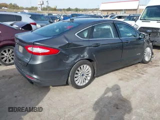 2015 Ford Fusion SE Hybrid with VIN 3FA6P0LUXFR266743, listed as a IAAI auction lot 40862039 with 116,610 mi miles. Bid and sale history available at carsss.com. Image 4.