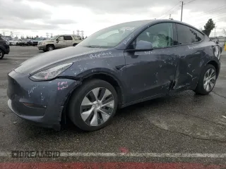 2022 Tesla Model Y Long Range z VIN 7SAYGDEE0NF355045, wystawiony jako Copart lot #51015325 z przebiegiem 47 797 mil mil oraz Szkoda całkowita • Salvage title. Historia ofert i sprzedaży dostępna na DreamBid. Obrazek 1.
