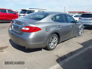 2013 Infiniti M with VIN JN1BY1AP3DM514462, listed as a IAAI auction lot 42141542 with 175,403 mi miles. Bid and sale history available at carsss.com. Image 4.