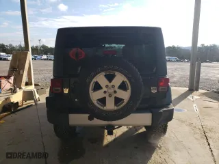2011 Jeep Wrangler Unlimited Sahara with VIN 1J4BA5H15BL635016, listed as a Copart auction lot 84433444 with 124,217 mi miles and Salvage Title. Bid and sale history available at carsss.com. Image 6.