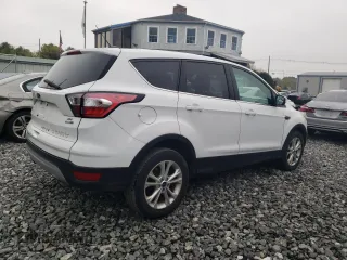 2017 Ford Escape SE with VIN 1FMCU9GDXHUD44286, listed as a Copart auction lot 54864485 with 138,212 mi miles and Clean Title. Bid and sale history available at carsss.com. Image 3.