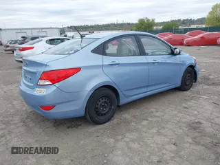 2014 Hyundai Accent GLS with VIN KMHCT4AE3EU702573, listed as a IAAI auction lot 42083350 with 123,392 mi miles. Bid and sale history available at carsss.com. Image 4.