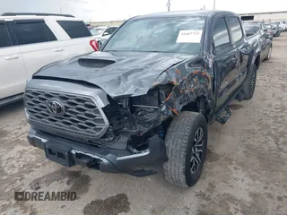 2022 Toyota Tacoma SR5 with VIN 3TMAZ5CN6NM186713, listed as a IAAI auction lot 42607719 with 60,704 mi miles and . Bid and sale history available at DreamBid. Image 2.