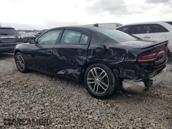 2019 Dodge Charger SXT with VIN 2C3CDXJG9KH523879, listed as a Copart auction lot 82988364 with 71,386 mi miles and Salvage Title. Bid and sale history available at DreamBid. Image 2.