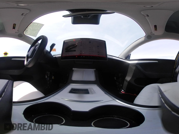 2023 Tesla Model Y Long Range z VIN 7SAYGDEE1PA158661, wystawiony jako IAAI lot #41983897 z przebiegiem 20 176 mil mil oraz . Historia ofert i sprzedaży dostępna na DreamBid. Obrazek 22.