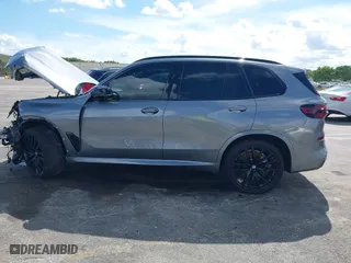 2025 BMW X5 M60i with VIN 5UX33EU03S9X62019, listed as a IAAI auction lot 41623189 with 5,749 mi miles. Bid and sale history available at carsss.com. Image 14.
