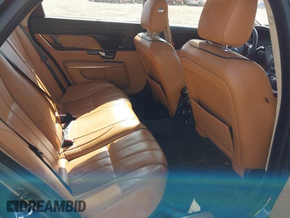 2013 Jaguar XJ Portfolio with VIN SAJWJ2GDXD8V55879, listed as a IAAI auction lot 41568366 with 121,119 mi miles and . Bid and sale history available at DreamBid. Image 8.