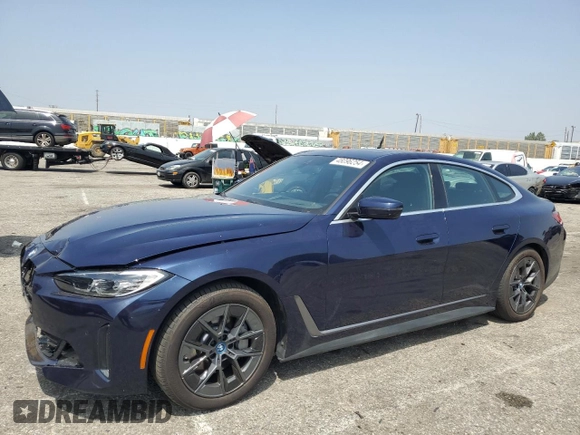 2023 BMW i4 eDrive40 with VIN WBY73AW09PFN76758, listed as a Copart auction lot 48096254 with 9,909 mi miles. Bid and sale history available at carsss.com. Image 1.