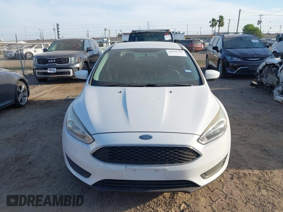 2018 Ford Focus SE z VIN 1FADP3F23JL328462, wystawiony jako IAAI lot #42068209 z przebiegiem 63 194 mil mil oraz . Historia ofert i sprzedaży dostępna na DreamBid. Obrazek 6.