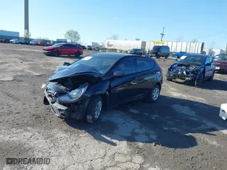 2014 Hyundai Accent GS with VIN KMHCT5AE0EU189319, listed as a IAAI auction lot 41985071 with 72,633 mi miles. Bid and sale history available at carsss.com. Image 2.