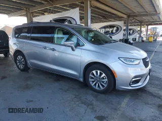 2021 Chrysler Pacifica Hybrid Touring L with VIN 2C4RC1L7XMR593911, listed as a Copart auction lot 57842415 with 74,910 mi miles and Salvage title. Bid and sale history available at DreamBid. Image 4.