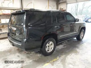 2015 GMC Yukon Denali with VIN 1GKS2CKJ4FR173703, listed as a IAAI auction lot 41943537 with 167,834 mi miles. Bid and sale history available at carsss.com. Image 4.