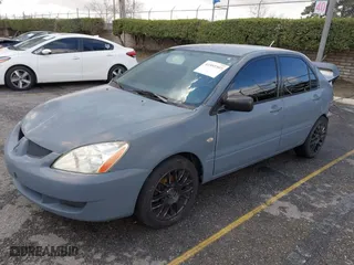 2004 Mitsubishi Lancer ES with VIN JA3AJ26E54U054570, listed as a IAAI auction lot 41592397 with 220,140 mi miles. Bid and sale history available at carsss.com. Image 2.