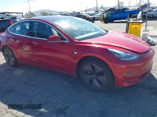 2018 Tesla Model 3 Long Range Battery with VIN 5YJ3E1EA6JF022061, listed as a IAAI auction lot 41602320 with 131,653 mi miles. Bid and sale history available at carsss.com. Image 1.