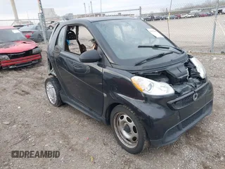 2015 Smart fortwo Passion with VIN WMEEJ3BA8FK811800, listed as a IAAI auction lot 41982401 with Not Provided miles and . Bid and sale history available at DreamBid. Image 1.