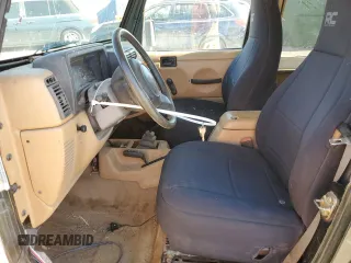 1997 Jeep Wrangler Sahara with VIN 1J4FY49S6VP521988, listed as a Copart auction lot 80753494 with 99,909 mi miles and Salvage Title. Bid and sale history available at carsss.com. Image 7.