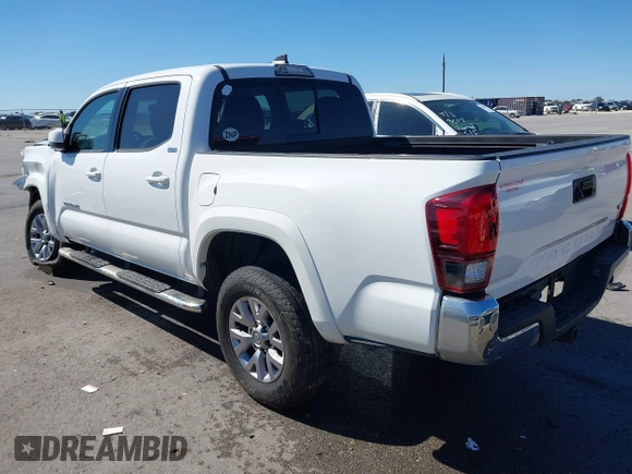 2018 Toyota Tacoma SR5 with VIN 5TFAZ5CN4JX056465, listed as a IAAI auction lot 41767848 with 71,532 mi miles and . Bid and sale history available at DreamBid. Image 3.
