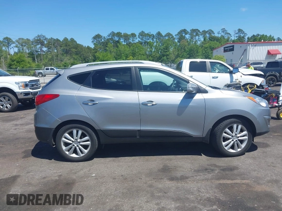 2013 Hyundai Tucson GLS with VIN KM8JU3AC4DU588062, listed as a IAAI auction lot 42080348 with 76,937 mi miles. Bid and sale history available at carsss.com. Image 13.