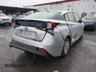2022 Toyota Prius L Eco with VIN JTDKAMFU1N3177055, listed as a IAAI auction lot 41506862 with 121,318 mi miles and . Bid and sale history available at DreamBid. Image 4.