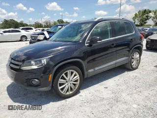 2014 Volkswagen Tiguan SE z VIN WVGAV3AX8EW613762, wystawiony jako Copart lot #61385765 z przebiegiem 167 278 mil mil oraz Czysty tytuł • Clean title. Historia ofert i sprzedaży dostępna na DreamBid. Obrazek 1.