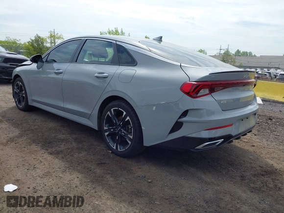 2023 Kia K5 GT-Line z VIN 5XXG64J26PG176483, wystawiony jako IAAI lot #42154614 z przebiegiem 61 050 mil mil oraz . Historia ofert i sprzedaży dostępna na DreamBid. Obrazek 3.