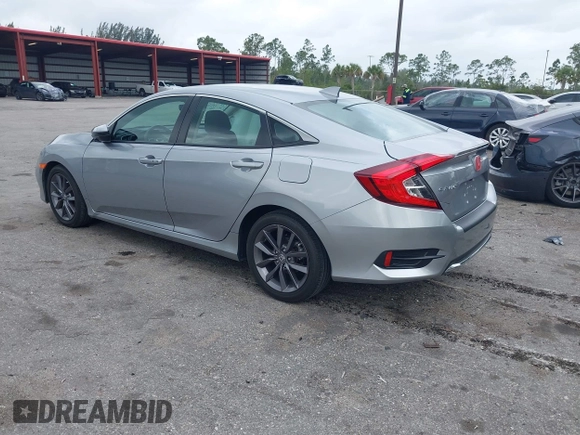 2021 Honda Civic Sedan EX-L with VIN 19XFC1F77ME008461, listed as a IAAI auction lot 41920231 with 31,912 mi miles. Bid and sale history available at carsss.com. Image 3.