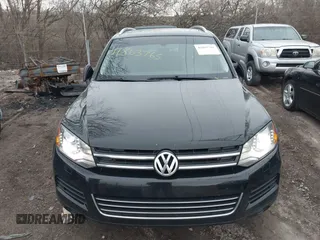 2012 Volkswagen Touareg Sport with VIN WVGFK9BP7CD002243, listed as a IAAI auction lot 41863765 with 136,231 mi miles and . Bid and sale history available at DreamBid. Image 17.
