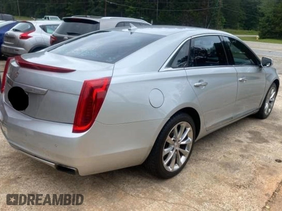2013 Cadillac XTS Luxury z VIN 2G61P5S33D9171411, wystawiony jako Copart lot #59880945 z przebiegiem 268 029 mil mil oraz Czysty tytuł • Clean title. Historia ofert i sprzedaży dostępna na DreamBid. Obrazek 4.