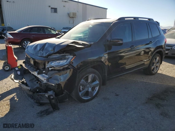 2020 Honda Passport Touring with VIN 5FNYF7H91LB001421, listed as a Copart auction lot 76954744 with 56,167 mi miles and Salvage Title. Bid and sale history available at carsss.com. Image 1.