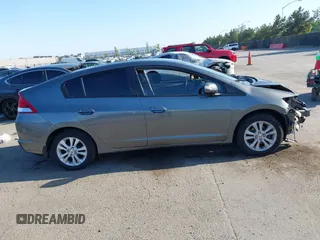 2012 Honda Insight EX z VIN JHMZE2H77CS001370, wystawiony jako IAAI lot #42312077 z przebiegiem 134 249 mil mil oraz . Historia ofert i sprzedaży dostępna na DreamBid. Obrazek 14.