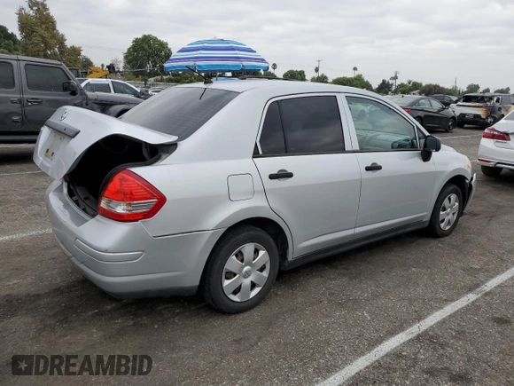 2009 Nissan Versa 1.6 with VIN 3N1CC11E79L429613, listed as a Copart auction lot 72220034 with 134,891 mi miles and Salvage Title. Bid and sale history available at carsss.com. Image 3.