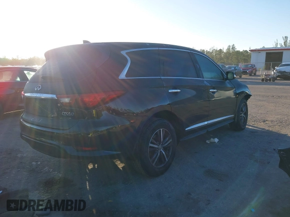 2019 Infiniti QX60 LUXE with VIN 5N1DL0MN0KC548592, listed as a IAAI auction lot 41305876 with 142,064 mi miles. Bid and sale history available at carsss.com. Image 4.