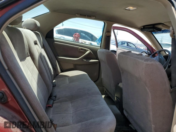 1999 Toyota Camry LE z VIN JT2BG22K6X0274398, wystawiony jako Copart lot #57263795 z przebiegiem 202 944 mil mil oraz Szkoda całkowita • Salvage title. Historia ofert i sprzedaży dostępna na DreamBid. Obrazek 10.