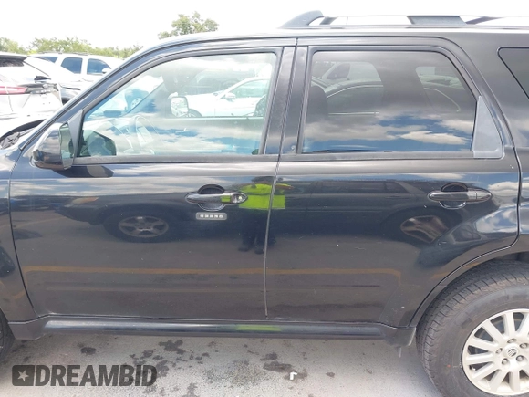 2011 Mercury Mariner Premier with VIN 4M2CN8HGXBKJ07489, listed as a IAAI auction lot 42574942 with 163,786 mi miles and . Bid and sale history available at DreamBid. Image 14.