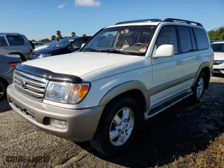 2003 Toyota Land Cruiser with VIN JTEHT05J932033529, listed as a Copart auction lot 73855214 with 0 mi miles and Salvage Title. Bid and sale history available at carsss.com. Image 1.