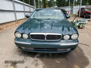 2004 Jaguar XJ with VIN SAJWA71C34SG16508, listed as a Copart auction lot 66751644 with 179,039 mi miles and Salvage Title. Bid and sale history available at carsss.com. Image 5.