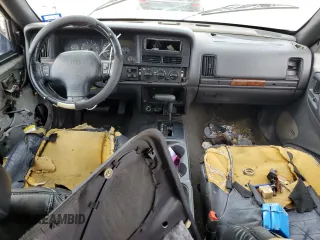 1998 Jeep Grand Cherokee with VIN 1J4FX48S6WC345358, listed as a Copart auction lot 85057454 with Not provided miles and Salvage title. Bid and sale history available at DreamBid. Image 8.
