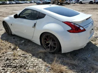 2014 Nissan 370Z Touring with VIN JN1AZ4EH0EM636520, listed as a Copart auction lot 73661434 with 0 mi miles and Salvage Title. Bid and sale history available at carsss.com. Image 2.