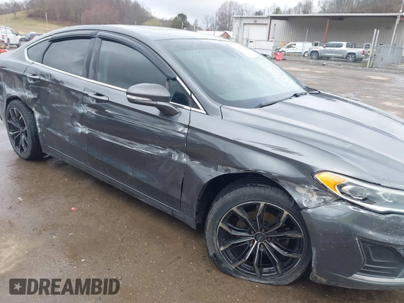 2019 Ford Fusion SEL with VIN 3FA6P0CD6KR141832, listed as a IAAI auction lot 41800102 with 142,282 mi miles and . Bid and sale history available at DreamBid. Image 6.