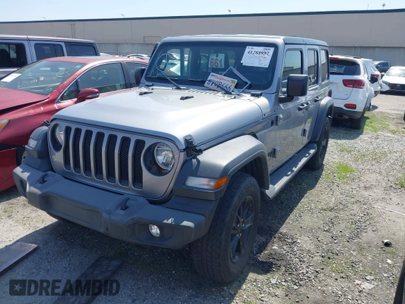 2021 Jeep Wrangler Unlimited Sport Altitude with VIN 1C4HJXDGXMW662493, listed as a IAAI auction lot 41288957 with 64,808 mi miles and . Bid and sale history available at DreamBid. Image 19.