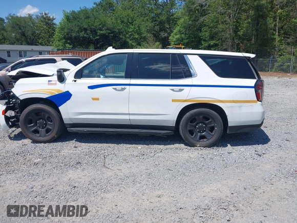2022 Chevrolet Tahoe Commercial z VIN 1GNSCLED4NR222340, wystawiony jako IAAI lot #42321388 z przebiegiem Nie podano mil oraz . Historia ofert i sprzedaży dostępna na DreamBid. Obrazek 14.