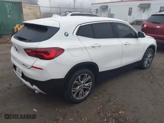 2022 BMW X2 sDrive28i with VIN WBXYH9C04N5U25732, listed as a IAAI auction lot 41015169 with 65,526 mi miles. Bid and sale history available at carsss.com. Image 4.